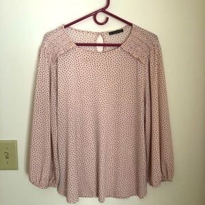 Pink long sleeved blouse with black hearts